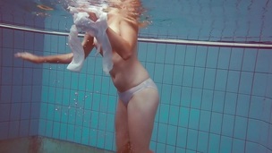 Cute Melissa plays underwater