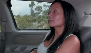 Raven haired chesty Colombian mommy Casandra is proud of her ideal huge fake boobs. Thats why this babe takes off her stingy bum hook and hooter-sling in the back of a car in front of the camera with no shame!